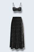 The Saint 54 Dolce Vita N3 two-piece set featuring a black polka dot crop top with lace trim and matching midi skirt.